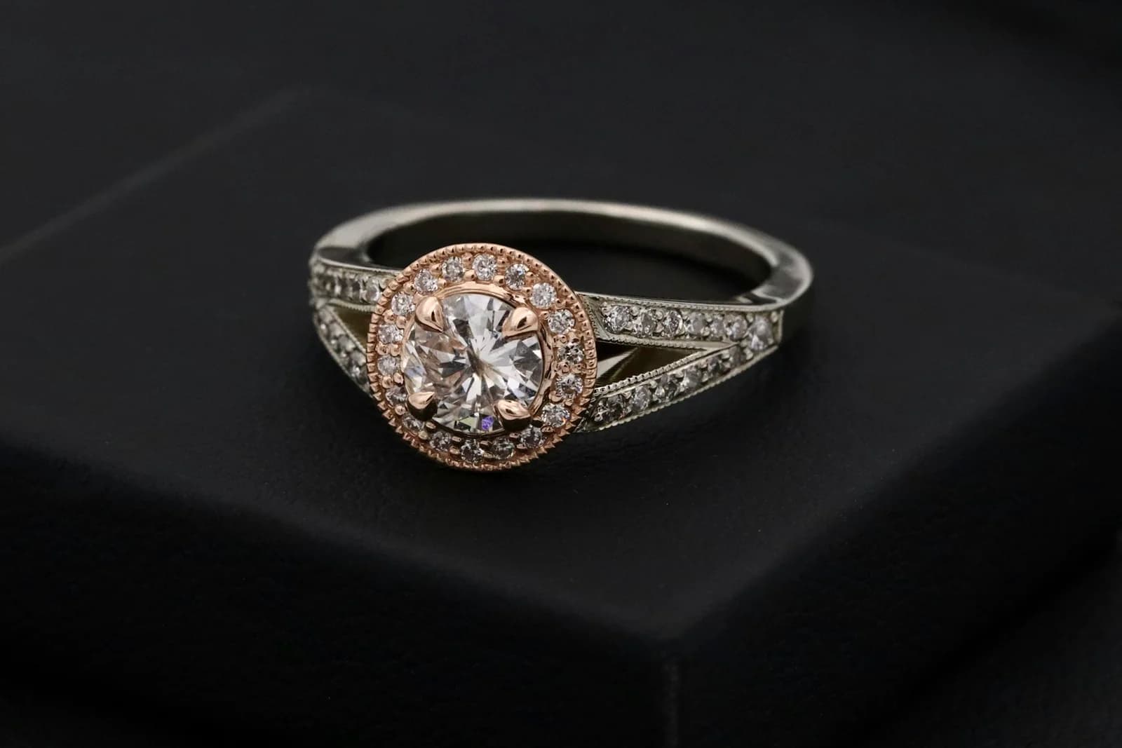 A diamond engagement ring resting on a black presentation box at Vale Fine Jewelry