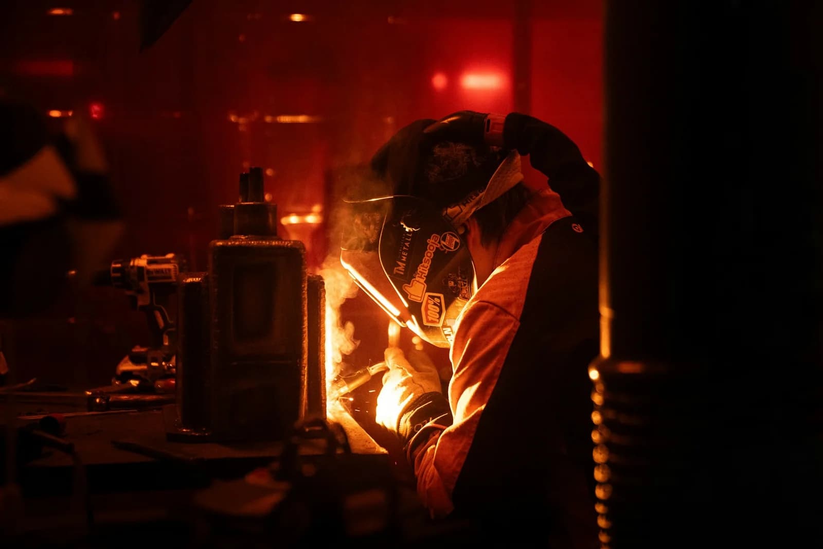 A welder working with bright sparks in a workshop at Craft Technical Academy